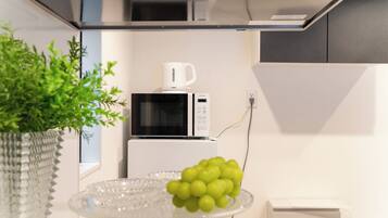 Deluxe Apartment, City View | Private kitchen | Full-size fridge, microwave, stovetop, electric kettle