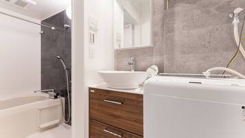 Deluxe Apartment, City View | Bathroom | Separate tub and shower, hair dryer, slippers, towels