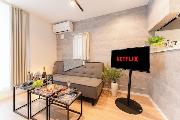 Deluxe Apartment, City View | Living area | 40-inch Smart TV with digital channels