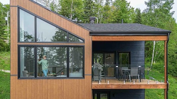 Sleek design blending with nature, your perfect getaway awaits.