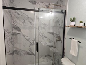 Shower, hair dryer, towels, soap