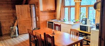 Riverfront cottage, sauna, hot tub, rowing boat, fishing, pets welcome.