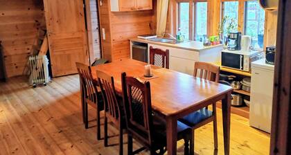 Riverfront cottage, sauna, hot tub, rowing boat, fishing, pets welcome.