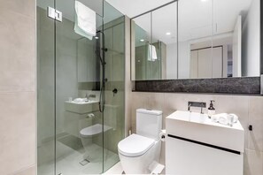 Shower, hair dryer, towels, soap