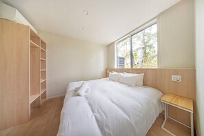 Desk, laptop workspace, blackout drapes, iron/ironing board