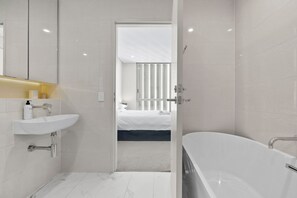 Shower, towels, shampoo, toilet paper