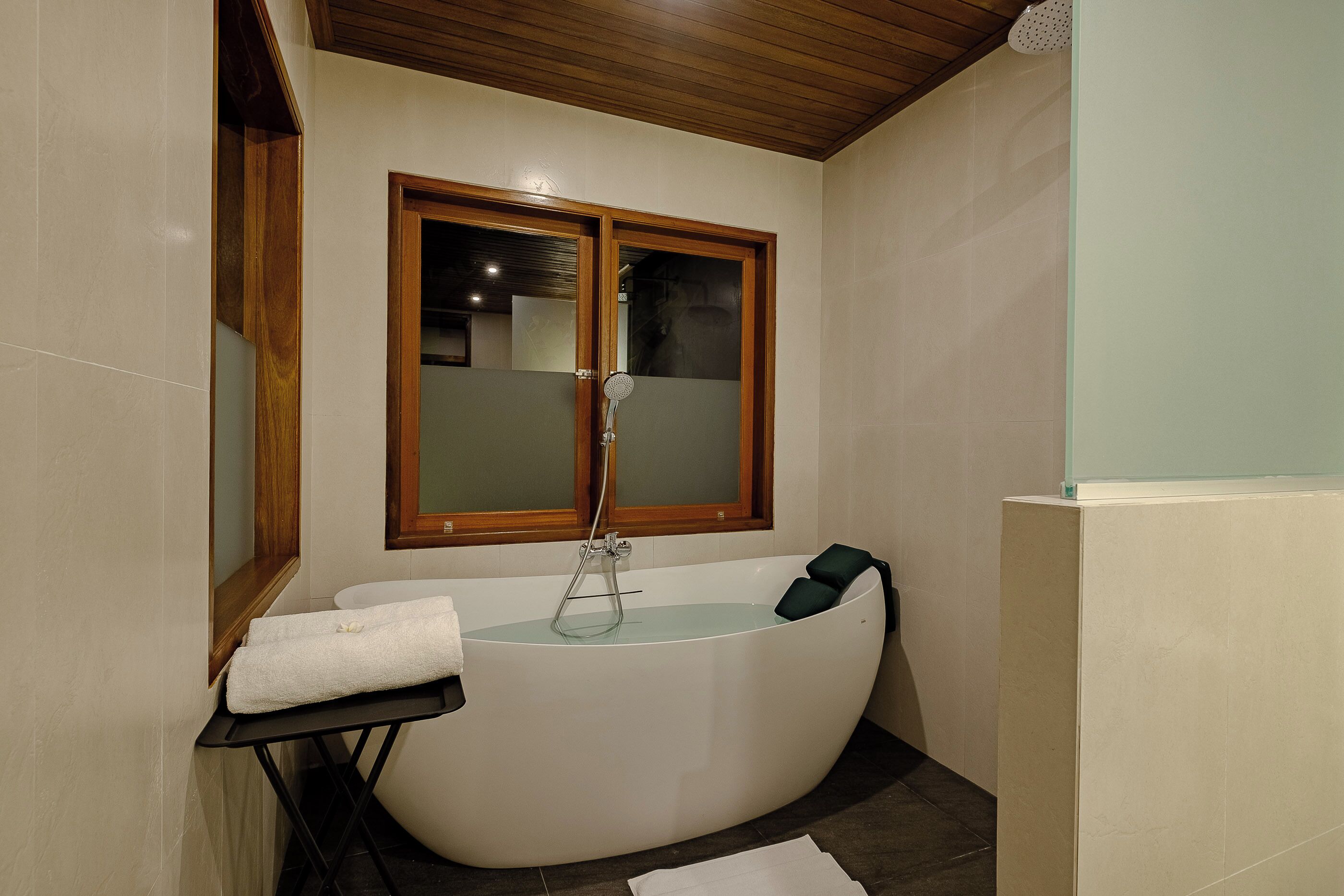 Separate tub and shower, bathrobes, slippers, towels