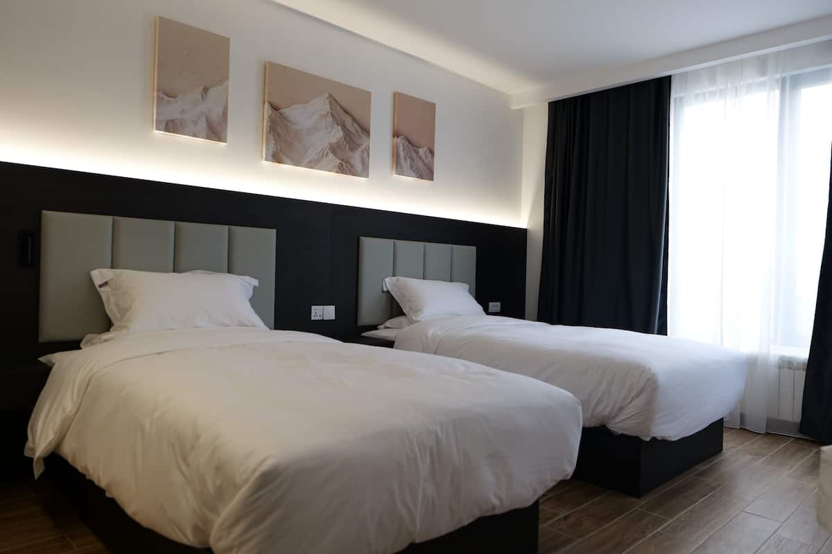 Deluxe Twin Room, Balcony | In-room safe, desk, laptop workspace, free WiFi