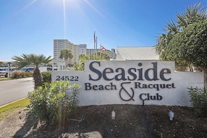 A sign for Seaside Beach & Racquet Club with a number 24522. - Seaside Beach 3902- 2 BR, direct beachfront condo with pool, sauna, amazing ocean view & balcony (Orange Beach)