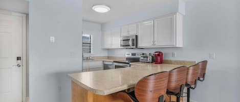 Coffee/tea maker, fridge, microwave, oven