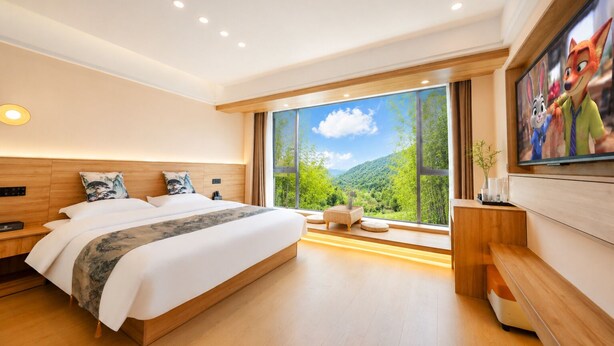 A modern hotel room with a large bed, a TV, a wooden headboard, and a large window with a mountain view. - Mount Huangshan Danqing Yayuan B&B Hotel (Huangshan)