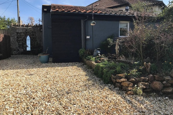 Exterior of property showing courtyard and garden.