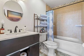 Shower, hair dryer, towels, shampoo