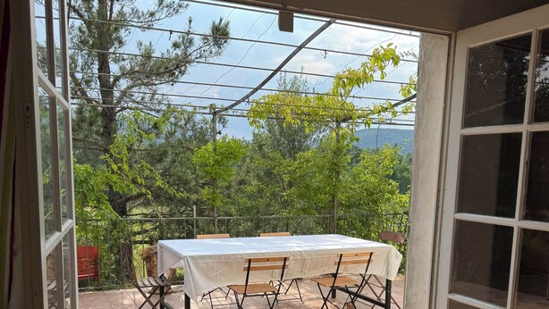 A room with a view of a patio area.