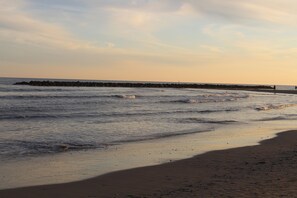 On the beach, sun-loungers