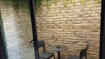 Economy Triple Room | Terrace/patio