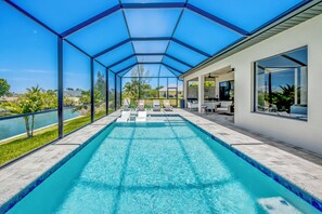 A heated pool - Exquisite 3 Bedroom/ 3 bath waterfront Villa with heated pool, guest suite, fishing poles (Cape Coral)