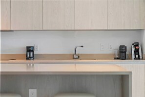 Coffee/tea maker, fridge, microwave, oven