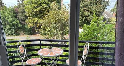 At a serene location opposite to the house of a double Nobel laureate