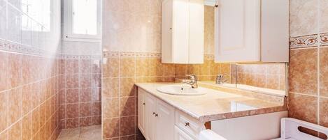 Shower, towels, soap, toilet paper