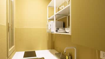 Fridge, microwave, stovetop, coffee/tea maker