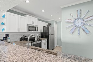 Townhome, Multiple Beds, Balcony (Edgewater Villa 3112) | Private kitchen | Dining tables - One More Round! 3BR 3BA Sleeps 10! 11 Pools! Golf Courses! Tennis Courts! (Panama City Beach)