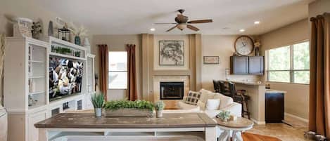 Smart TV, fireplace, books, offices