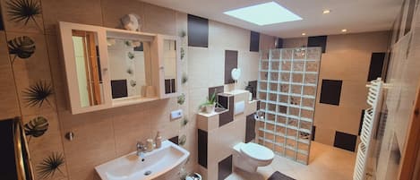 Shower, hair dryer, towels, soap