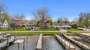 A residential area with houses, a dock, and a water body.