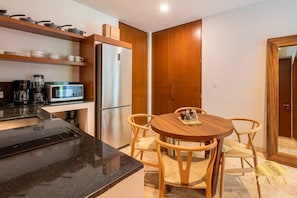 Fridge, microwave, stovetop, coffee/tea maker