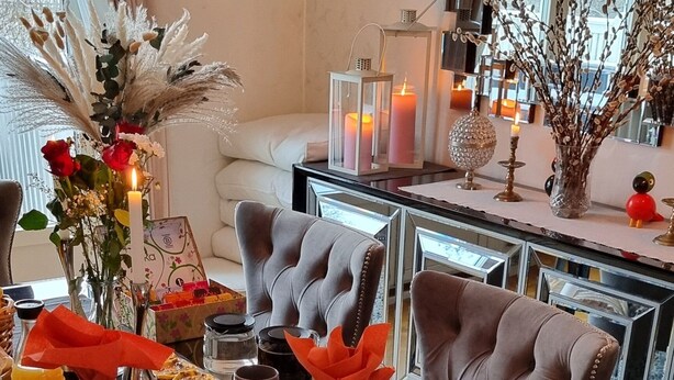 A breakfast buffet with various food items and a decorative centerpiece. - Room-bed & Breakfast in Stockholm (Bromma)