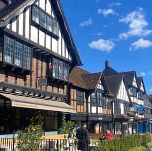 Traditional building with a prominent balcony, featuring exposed beams and a historic facade.