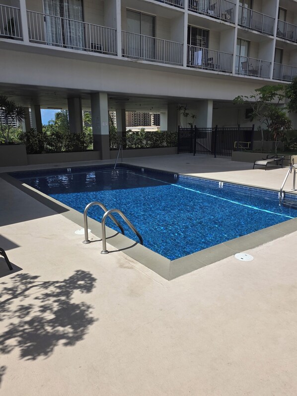 Outdoor pool, a heated pool - 14th FL centrally located Waikiki condo views of both the ocean and mountains (Honolulu)