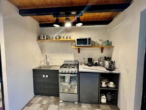 Fridge, microwave, stovetop, coffee/tea maker
