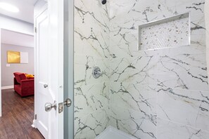 Shower, hair dryer, towels, soap