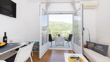 Apartment, Balcony, Sea View | 1 bedroom, individually decorated, individually furnished, desk