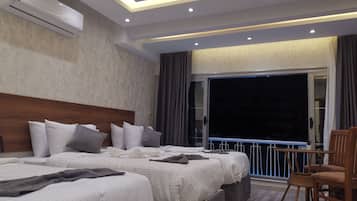 Quarto triplo superior, vista para a cidade | Vista para a cidade