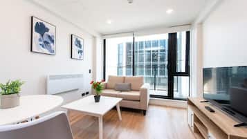 Superior Apartment | Living area | Flat-screen TV