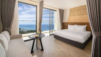 Deluxe Studio Suite, 2 Queen Beds, Balcony, Beach View | In-room safe, desk, laptop workspace, blackout drapes