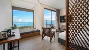Deluxe Studio Suite, 2 Queen Beds, Balcony, Beach View | In-room safe, desk, laptop workspace, blackout drapes
