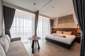 Deluxe Studio Suite, 2 Queen Beds, Balcony, Beach View | In-room safe, desk, laptop workspace, blackout drapes - DaVanie- Apec Mandala Phu Yen (Tuy Hoa)