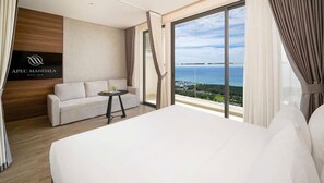 Deluxe Studio Suite, 2 Queen Beds, Balcony, Beach View | In-room safe, desk, laptop workspace, blackout curtains - DaVanie- Apec Mandala Phu Yen (Tuy Hoa)