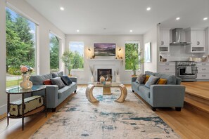 Smart TV, fireplace, books, printers