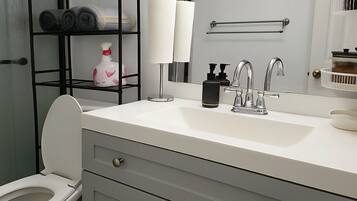 Shower, towels, soap, toilet paper