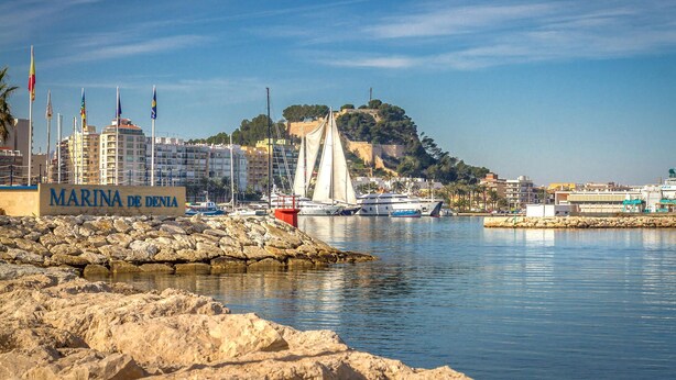 A marina with boats, a sign reading "MARINA DE DENIA", and buildings in the background. - Awesome home in Orba with WiFi (Orba)