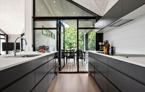 Fridge, stovetop, dishwasher, coffee/tea maker