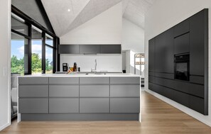 Fridge, stovetop, dishwasher, coffee/tea maker