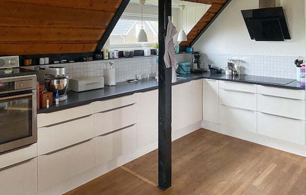 Fridge, stovetop, dishwasher, coffee/tea maker