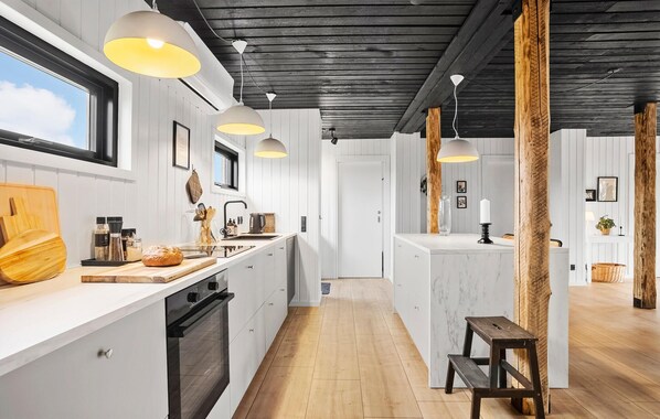 Fridge, stovetop, dishwasher, coffee/tea maker
