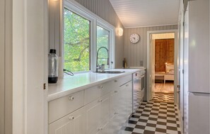 Fridge, stovetop, dishwasher, coffee/tea maker